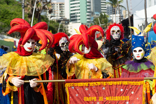 Salvador, Bahia, Brazil - February 11, 2023: Members of the masked group Maralegria are seen parading in Fuzue, pre-carnival in Salvador, Bahia, Brazil.