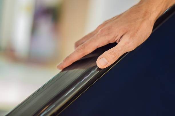 istock Hand is holding the escalator, blur background 1591807484