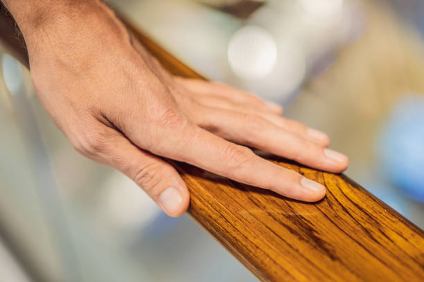 istock support, help and people concept - close up of man hand holding to railing 1591807492