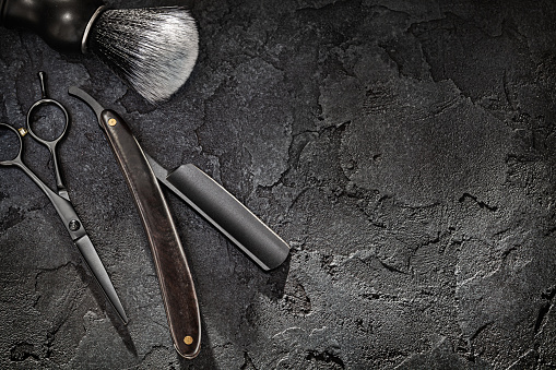 Black Tools Of Barber. Barber Shop. Professional Hair Cutting Scissors Hairdresser Stright Razor Shaving Brush. On Black Background