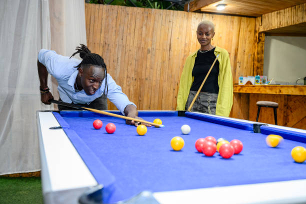 istock Friendly game of pool at Nairobi bar 1591812569