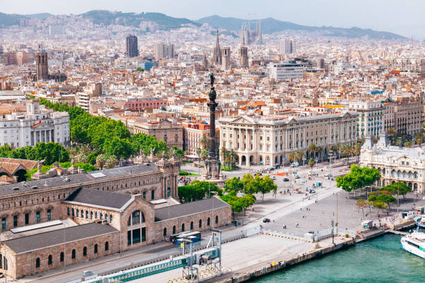 istock Panoramic view of Barcelona from above with landmarks and coastline. 1591813170
