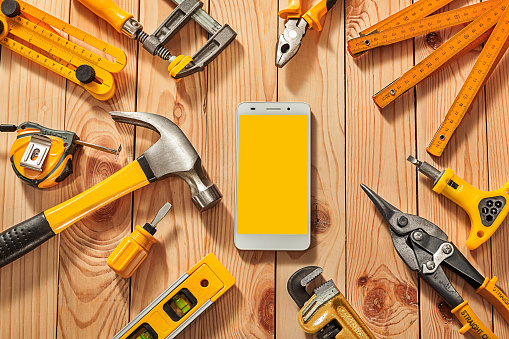 Mock Up Big Set Of Yellow Construction Tools Smartphone With Free Space For Your Text