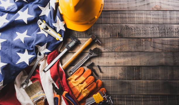istock Happy Labor day concept. American flag with different construction tools on dark wooden background. 1591820136