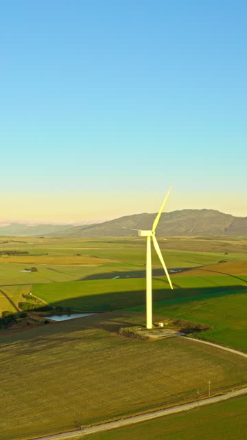 Aerial view, wind turbine and sustainability with renewable energy, eco friendly or climate change with ecology. Environment, drone or electricity with new source, sustainable or alternative solution