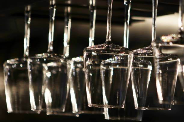 istock Hanging wine glasses in a restaurant 1591878676