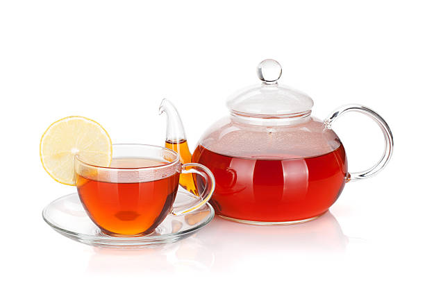 istock Glass teapot and cup of black tea with lemon slice 159189089