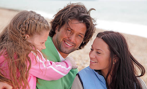 istock young family at the beach 159189309