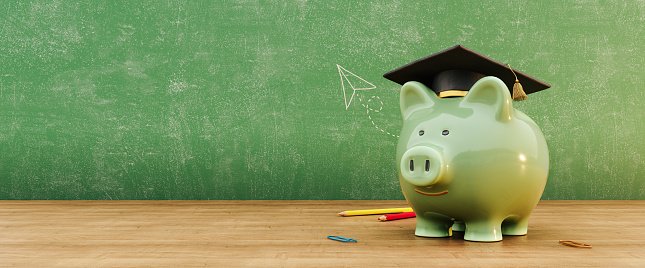 Green piggy bank wearing graduation hat in front of green chalkboard with copy space. Scholarship savings concept background. 3D Rendering, 3D Illustration