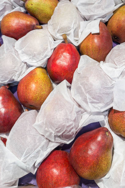 istock Pears neatly wrapped in paper. vertical photo 1591913014