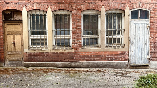 Old industrial building, 2 doors, 4 windows