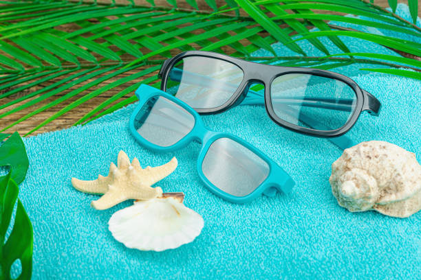 istock Summer vacation concept. Bath towel, sunglasses, marine decor. 1591926301