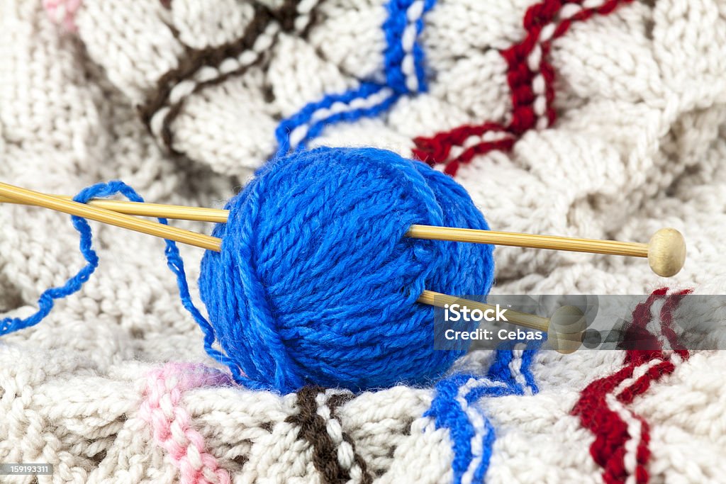 Blue yarn Ball of blue yarn with knitting needle Art And Craft Stock Photo