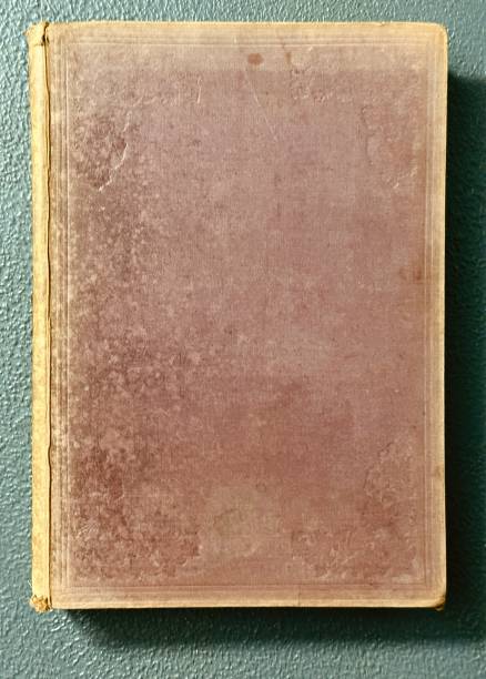 istock Very old book title from 19th century, brown, yellowed 1591936264