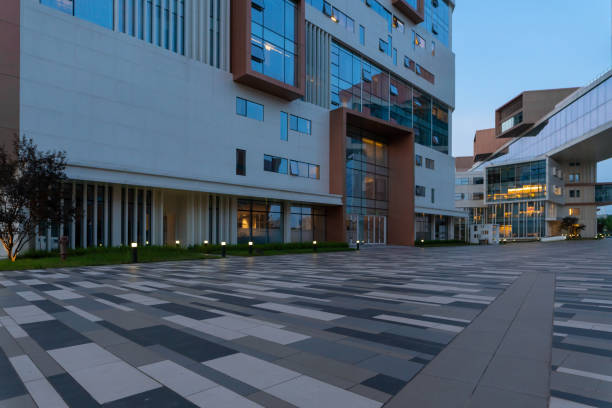 istock empty ground for copy space and modern street with office buildings. 1591990287