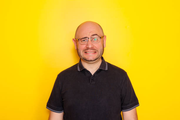 istock Funny mid 30s bald overweight man portrait 1591991385