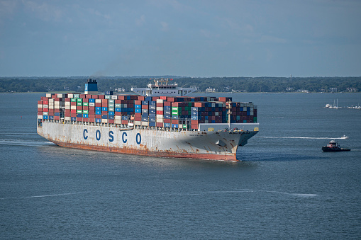 Charleston, SC, USA - August 03, 2023: Fortune, a 366-meter cargo vessel owned by China Ocean Shipping Company and flagged to Hong Kong, sails into Charleston Harbor.