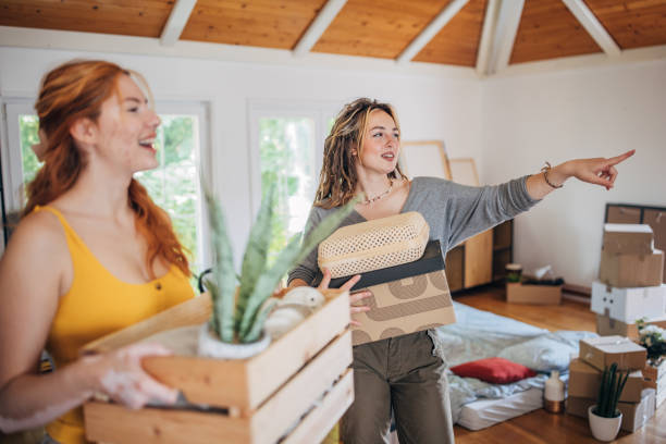 istock Lesbian couple in new apartment 1592011199