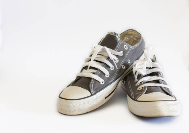 istock gray sneakers isolated on white background 1592011749