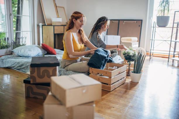 istock Lesbian couple in their new apartment 1592013432