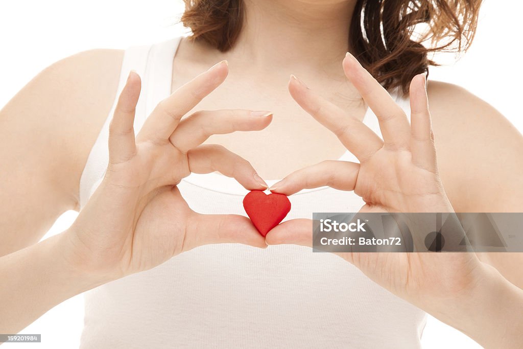 Mani di donna con biscotti a forma di cuore - Foto stock royalty-free di Adulto