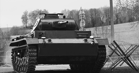 German Wehrmacht Light Panzer Tank Moves Into Position. German Wehrmacht World War Ii Automotive. Armored Combat Tank. Reconstruction Of Battles World War Ii. Black And White .