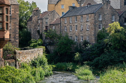 View of the Water of Leith, and the surrounding Georgian style buildings of Dean Village.  Dean Village is a tranquil alcove in the northwest of Edinburgh.