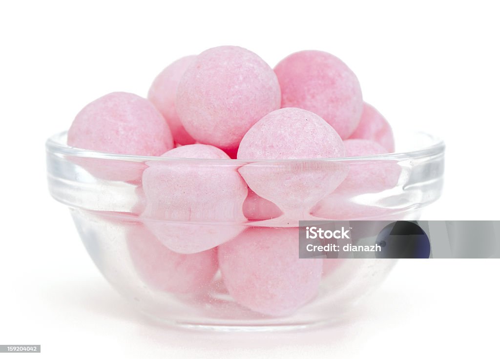 candies in a glass bowl over white Bowl Stock Photo