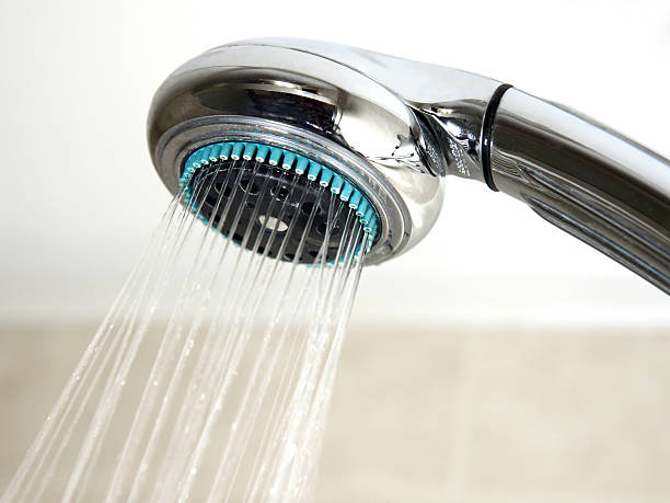 istock Shower head and running water in the bathroom 159204798
