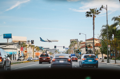 Plane flying over the streets of Los Angeles, California.
