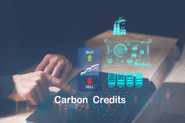 istock Trader using computer laptop to trade carbon credit on application. Net zero emission, Clean technology, Renewable energy concept, carbon ETF to invest in sustainable business. green climate funds 1592051494