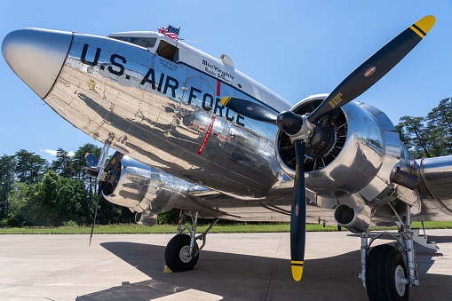 Dulles, United States – June 06, 2023: A close-up shot of a vintage military DC3 aircraft in a landing zone