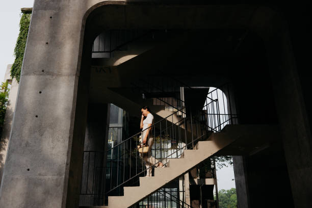 istock Asian woman in a modern office park 1592060080