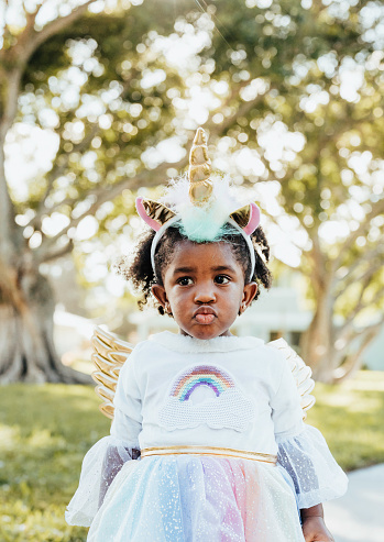 Adorable little girl dressed in halloween costume