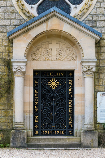 FLEURY-DEVANT-DOUAUMONT, FRANCE - JANUAR 05, 2020 : door and ironwork of the Saint-Nicolas chapel, Notre-Dame-de-l'Europe, near Verdun in First World War One