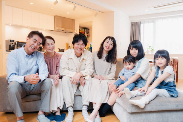 istock Smiling three-generation family group photo 1592087738