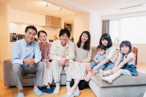 istock Smiling three-generation family group photo 1592087872