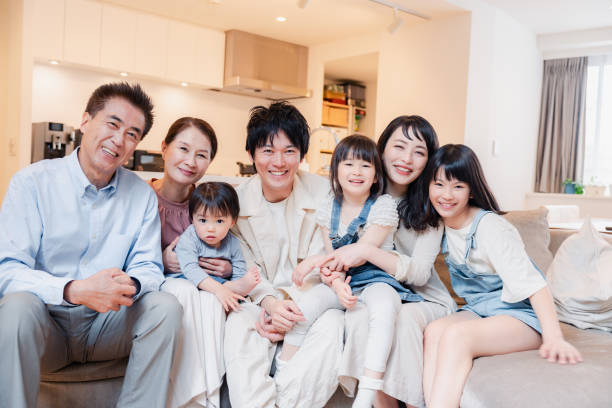 istock Smiling three-generation family group photo 1592087875