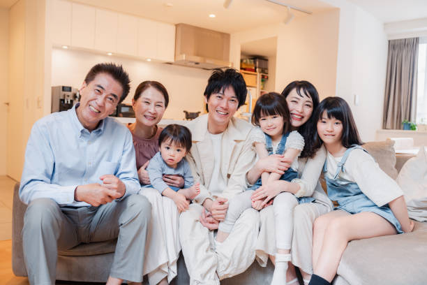 istock Smiling three-generation family group photo 1592087885