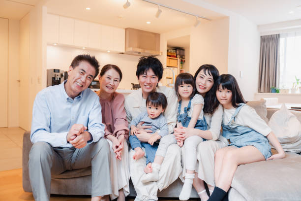 istock Smiling three-generation family group photo 1592087888