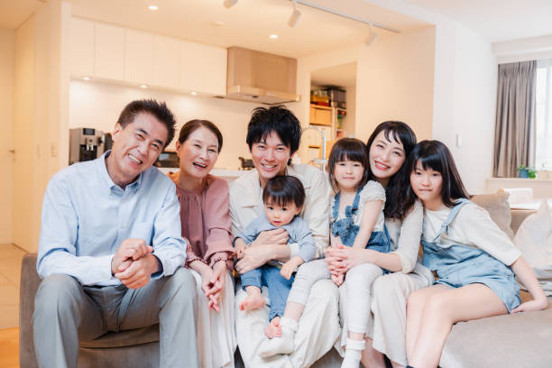istock Smiling three-generation family group photo 1592087895