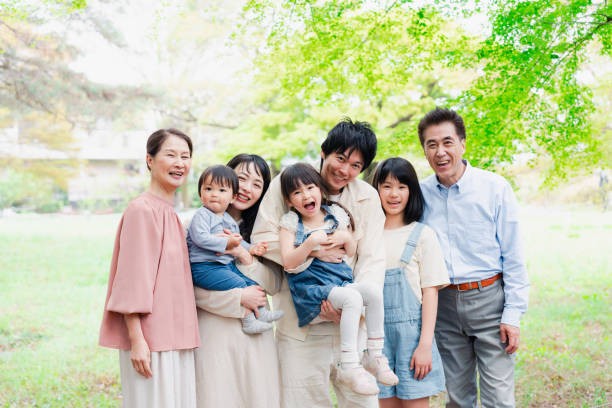 istock Smiling three-generation family group photo 1592087896