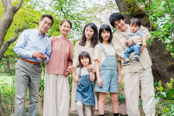 istock Smiling three-generation family group photo 1592087899