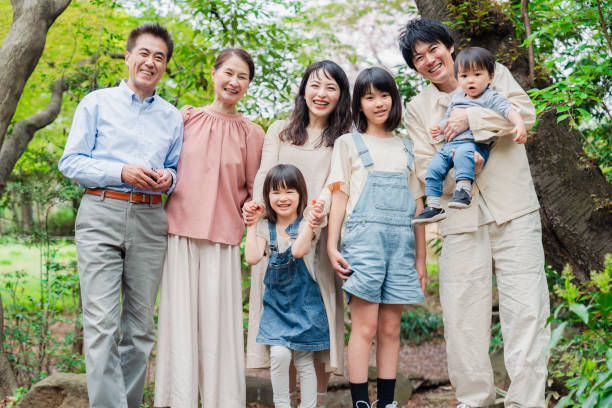 istock Smiling three-generation family group photo 1592087902