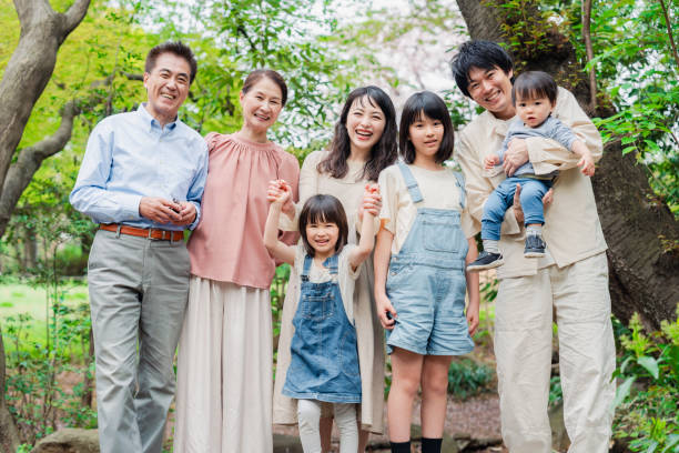 istock Smiling three-generation family group photo 1592087903