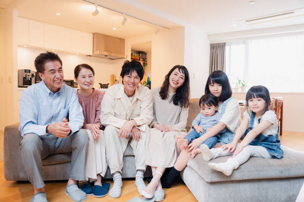 istock Smiling three-generation family group photo 1592088059