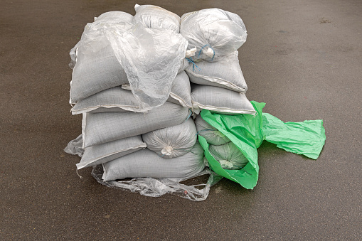 Stack of Sacks With Bulk Material Storage at Street