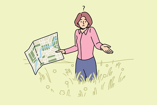 Lost woman with map stands in field and shrugs shoulders, not knowing where to go to find way home. Lost girl in business clothes is among tall grass, not understanding how to get out this situation