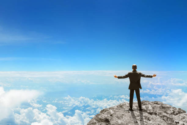 Free Stock Photo of Man Standing on Top of a Mountain Above the Clouds ...
