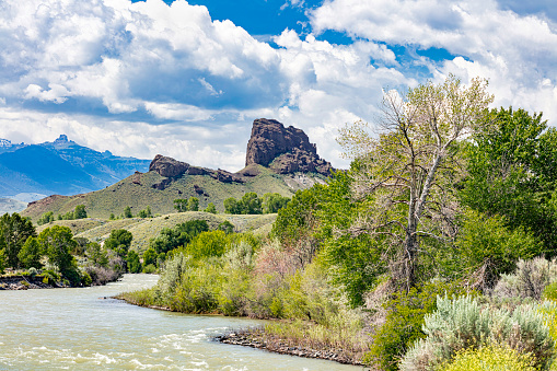 Shoshone River Southfork Valley and the Castle Rock formation with blue sky and clouds.